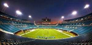 Empty football stadium at night.