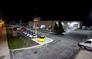 Nighttime view of a car dealership.