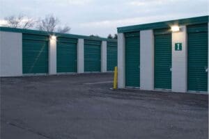 Row of green storage unit doors.