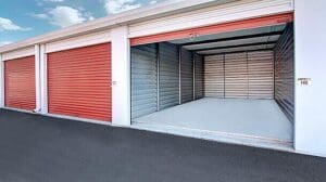 Storage unit with open door and grey floor.
