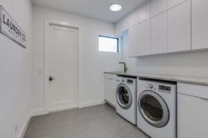 White laundry room with washer and dryer.