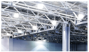 Industrial building with metal beams and lights.
