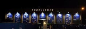 Excellence sign with athletic images.