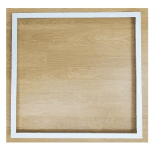 White picture frame on a wood background.