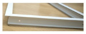 Closeup of white metal door frame.