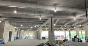 Here's an alt tag for the image: Concrete building interior under construction.
