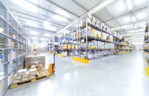Bright warehouse with organized shelves and boxes.